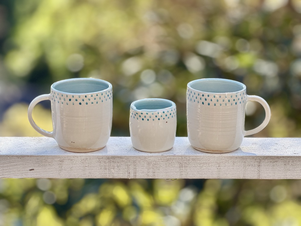 Porcelain White and blue with blue dots and creamer (discounted for glaze bubbles in one mug), handmade by Suzanne Luna