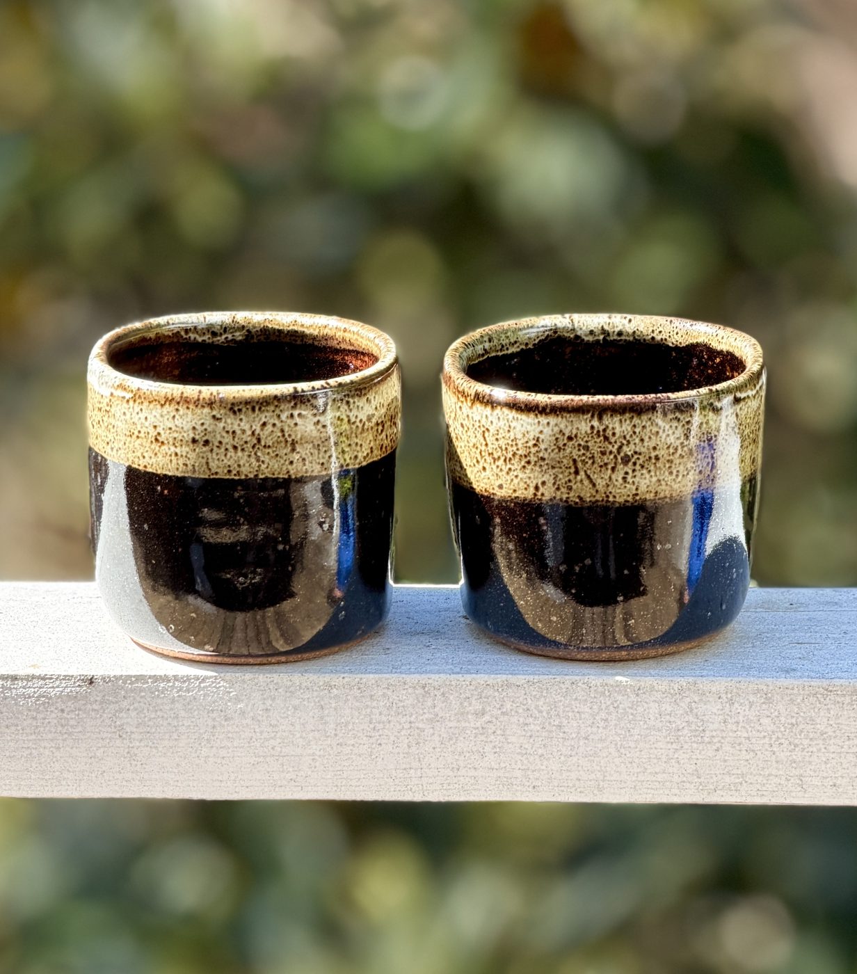 Stoneware Brown slightly squared handle free mugs with light rim, handmade by Suzanne Luna