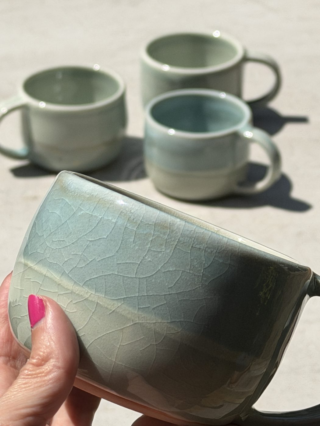 Porcelain pair of “Sea to Sand” mugs, handmade by Suzanne Luna