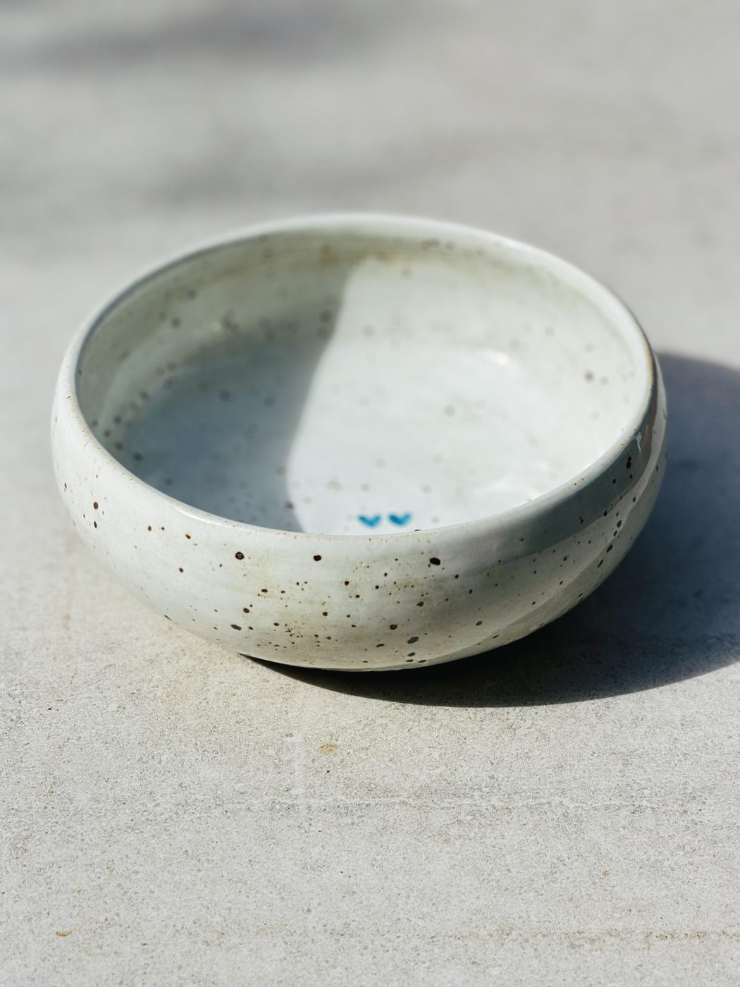 Stoneware Medium white speckled bowl two hearts, handmade by Suzanne Luna