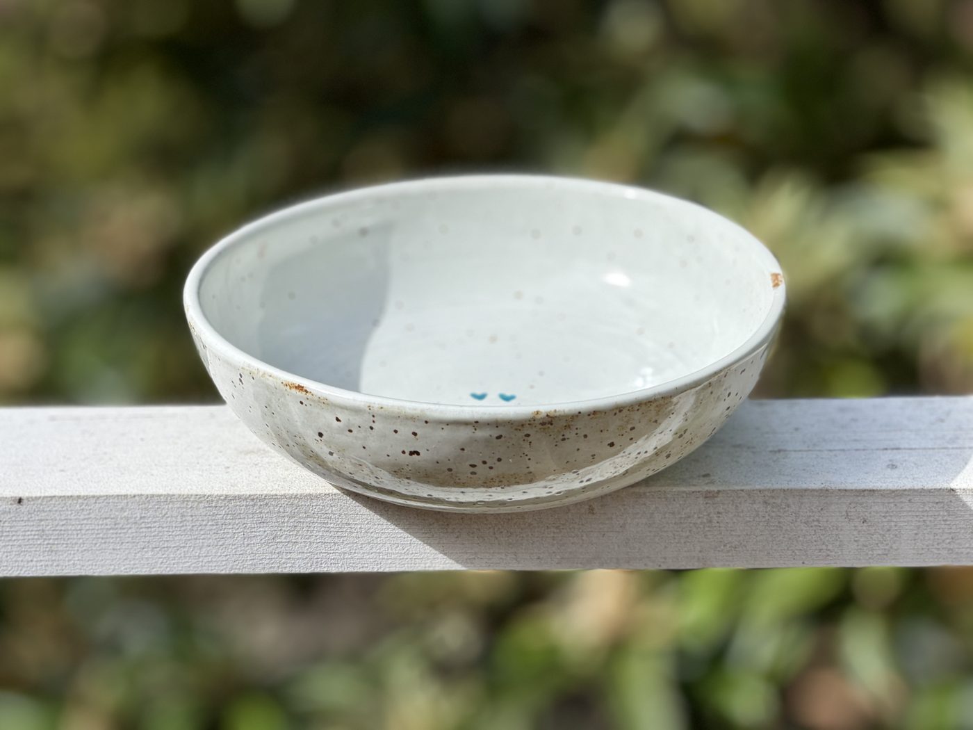 Stoneware Large speckled white bowl with two hearts, handmade by Suzanne Luna