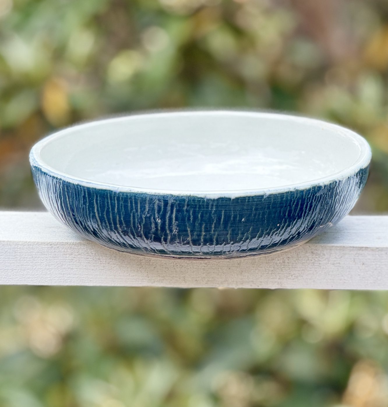 Low wide bowl with blue exterior crackle, handmade by Suzanne Luna