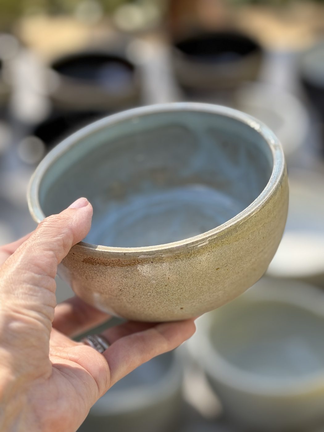 Stoneware medium Grey satin bowl bits of pale blue interior, handmade by Suzanne Luna